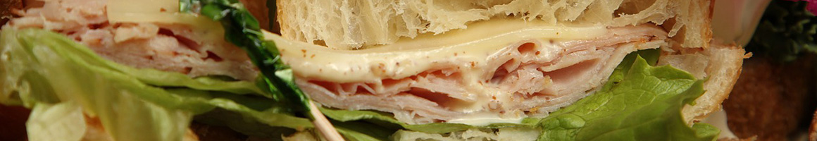 Eating Sandwich at Sisters Gourmet Deli restaurant in Portland, ME.